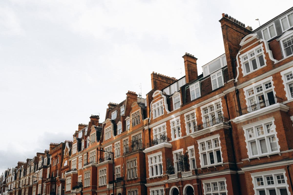 Classic red brick terraced houses in a London residential street