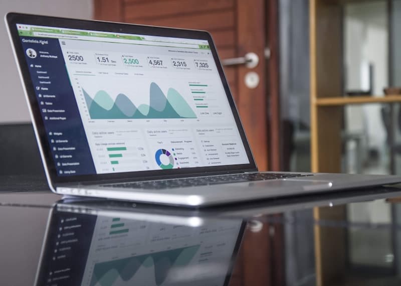 Laptop with financial charts