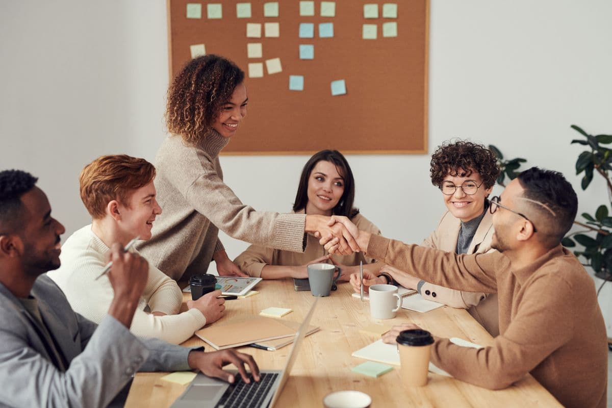 Team collaborating around a table with documents