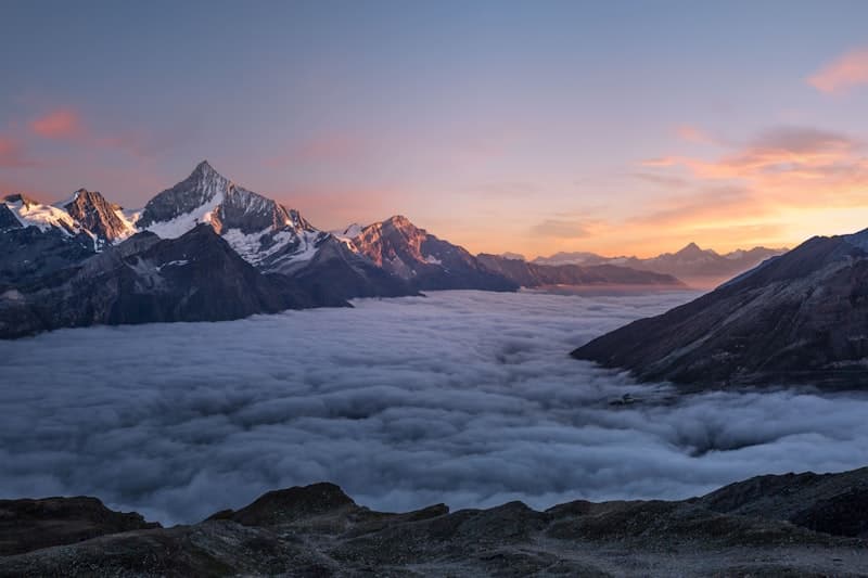 Mountain peak at sunrise representing financial freedom